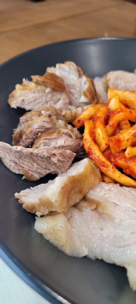 Bossam, Korean pork belly served with kimchi and wrapping leaves