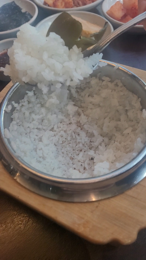 Golden scorched rice crust left at the bottom of an empty rice pot