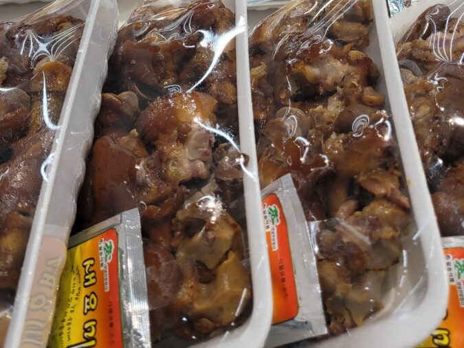 Fried chicken and braised pig trotter at a Korean supermarket hot counter