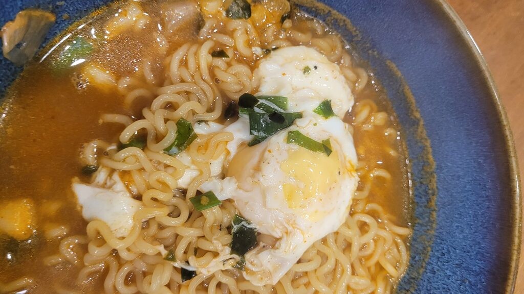 Korean ramen finished with a soft-set egg and scallion